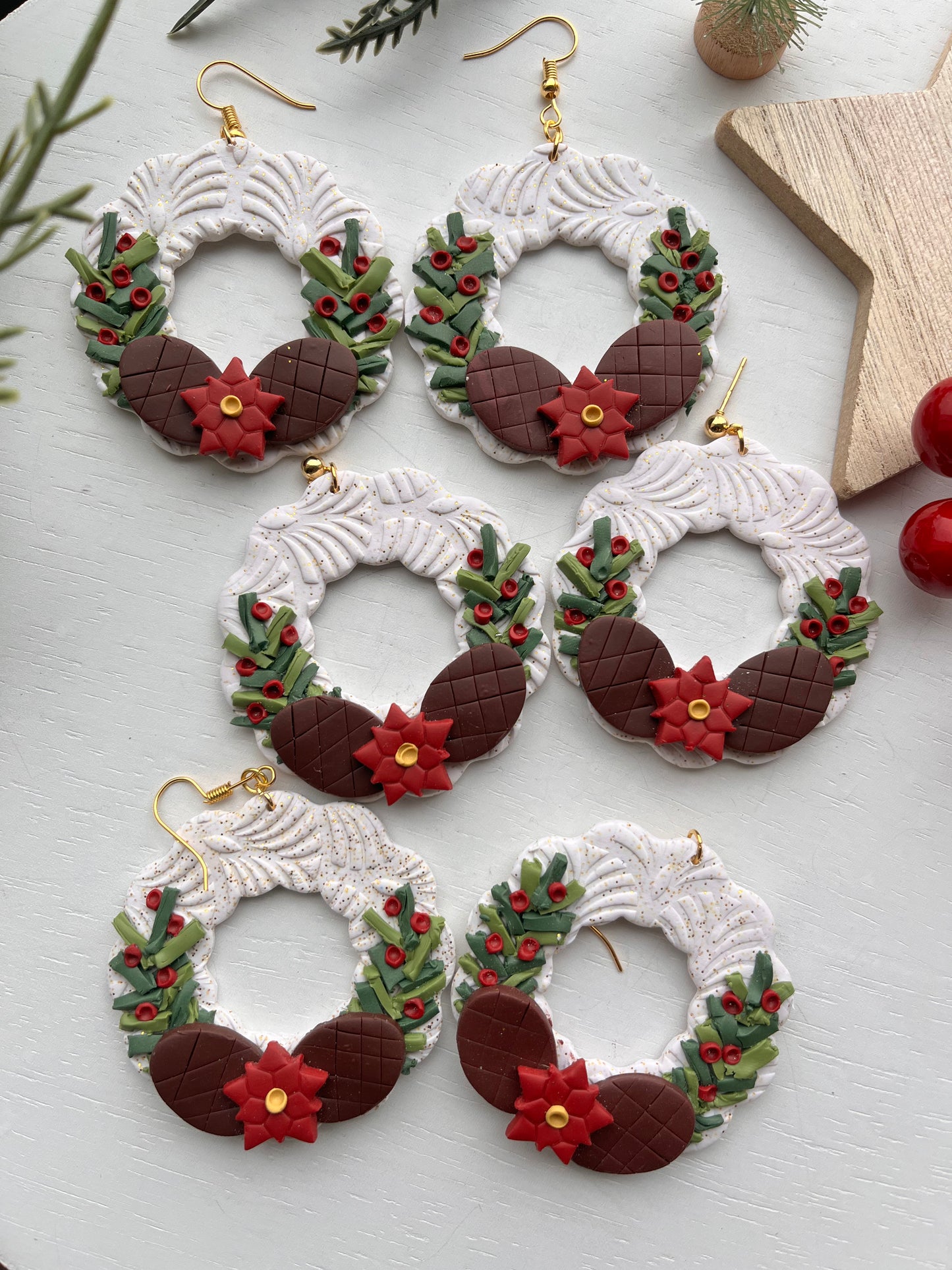 White Wreath with Greenery and Pine Cones