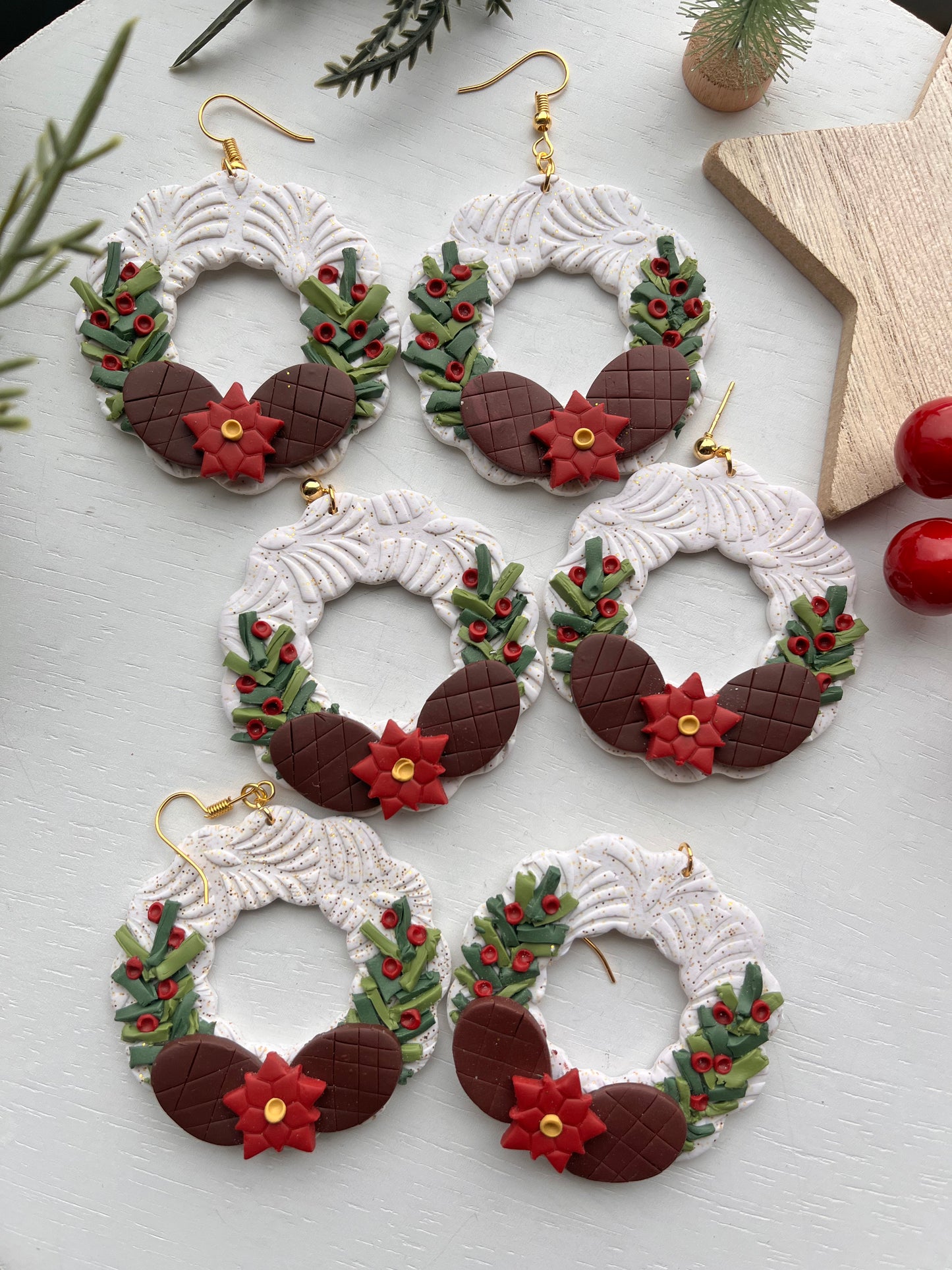 White Wreath with Greenery and Pine Cones