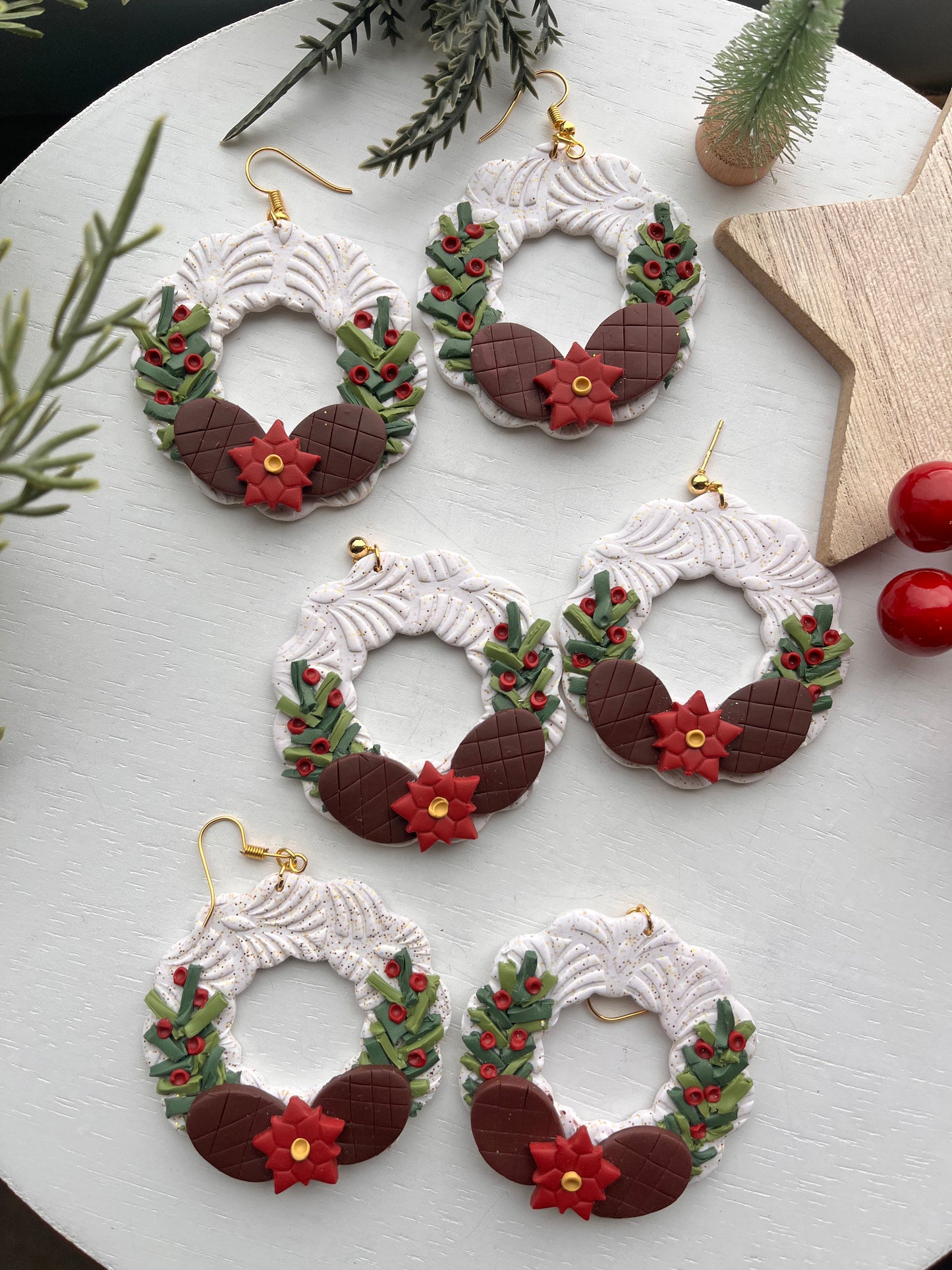 White Wreath with Greenery and Pine Cones